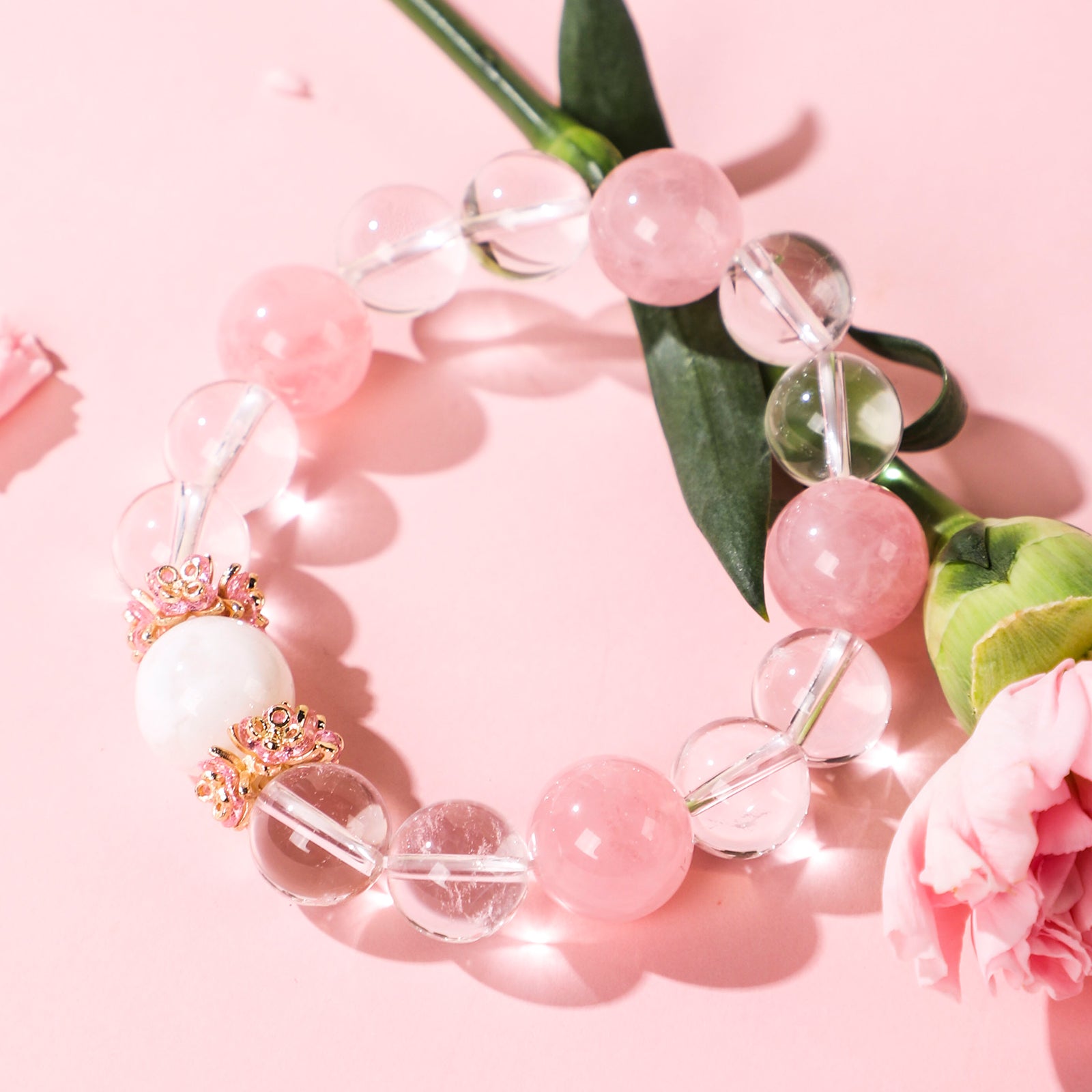 Minimalist bracelet featuring four pink beads and white crystal beads