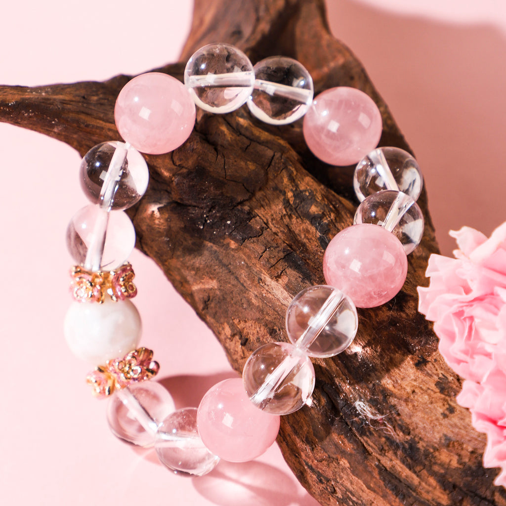 Minimalist bracelet featuring four pink beads and white crystal beads