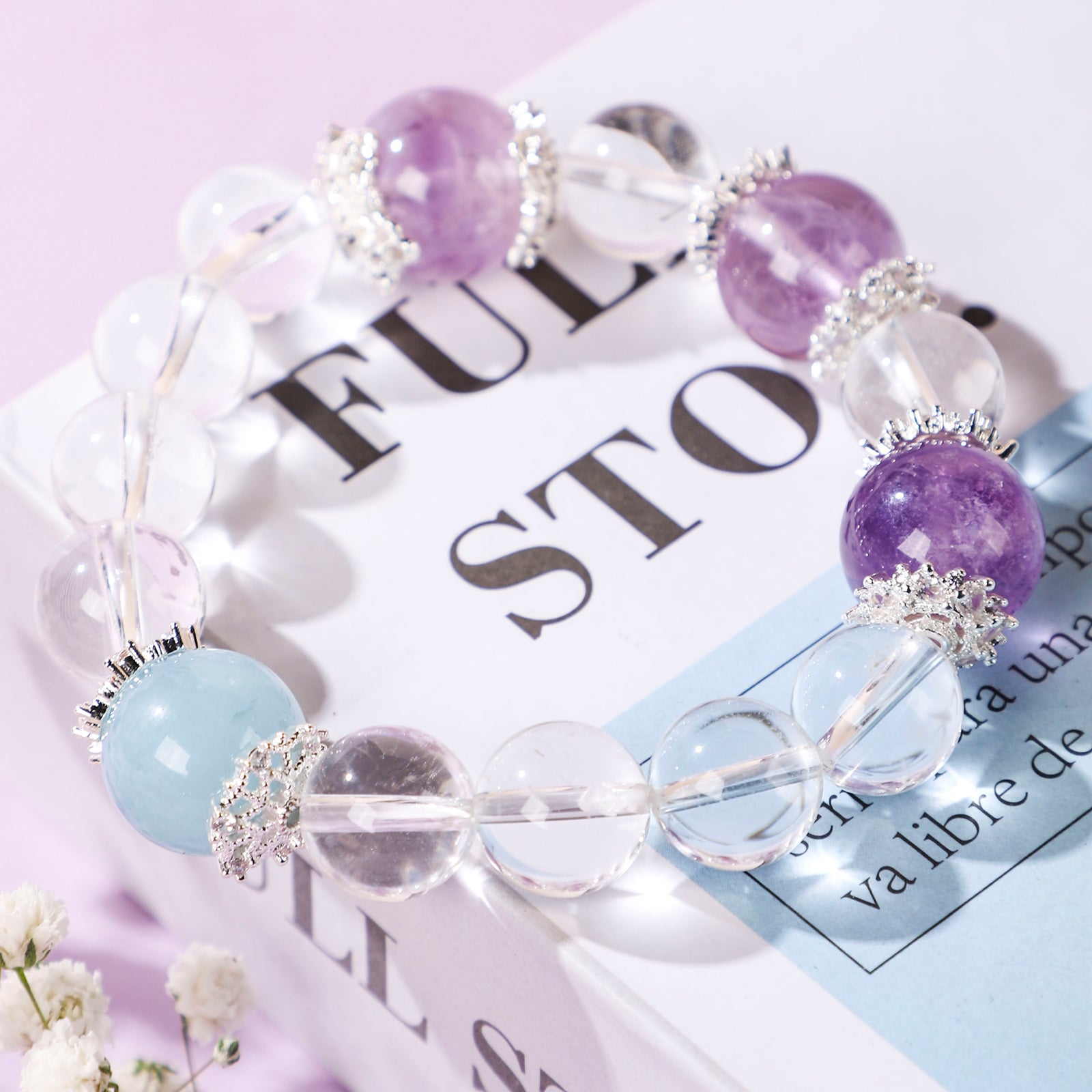 Minimalist crystal bracelet with three purple beads and one blue bead